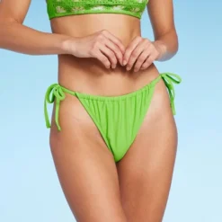 Women's Low-Rise Side-Tie Cheeky Bikini Bottom - Wild Fable™ 17 Women's Low-Rise Side-Tie Cheeky Bikini Bottom - Wild Fable™ -Wild Fable Shop GUEST fb45f3d8 0545 4021 95ce 6cc80b70ceec